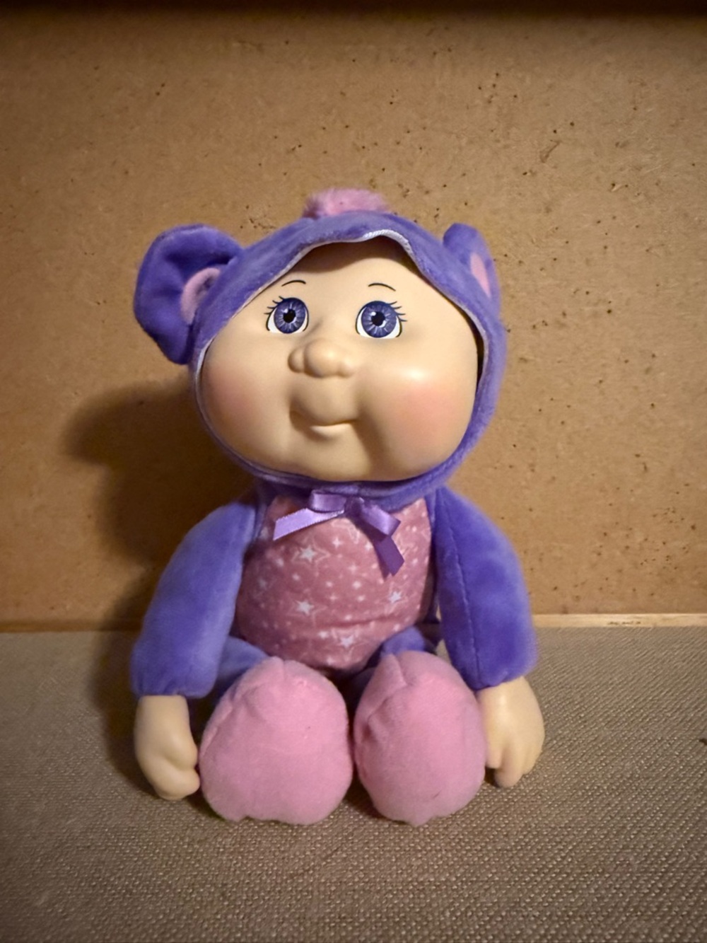 Plush Baby Doll in Purple Hooded Suit with Pink Star Bodysuit